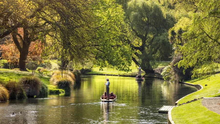 Punting boat gliding through the gardens of Hagley Park on the Avon River
