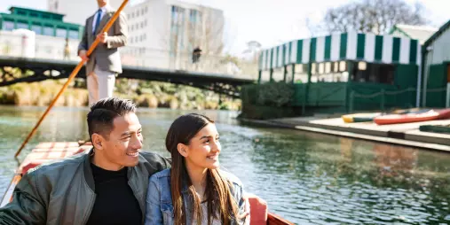 Couple enjoying a romantic punt ride on the Avon River near Antigua Boat Sheds