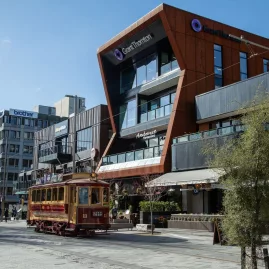 Tram 11 passing Grant Thornton House on Worcester Boulevard in Christchurch