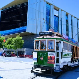 Christchurch Tram 152 passing by Tūranga Central Library in Cathedral Square