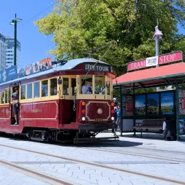 Christchurch Tram stopping at the Cathedral Square tram stop with passengers aboard
