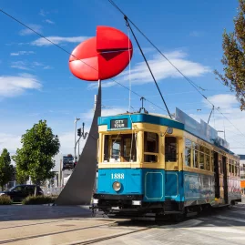 Nucleus sculpture by Phil Price in Christchurch’s SALT District with the historic Christchurch Tram nearby