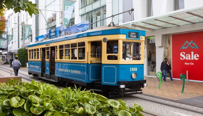 Blue City Tour tram travelling along Cashel Street in Christchurch city centre.