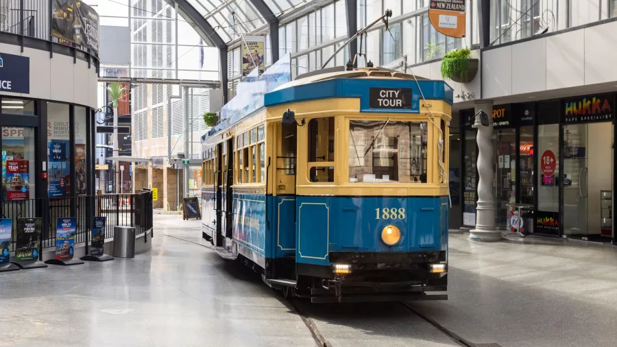 Christchurch tram passing through the glass-roofed Cathedral Junction arcade.