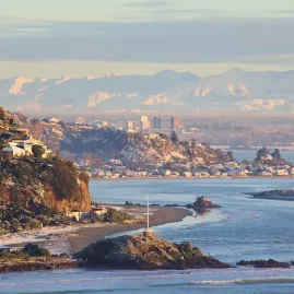 View of Sumner and Christchurch with the Southern Alps in the background