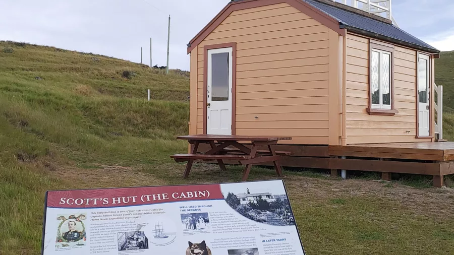 Scott’s Cabin and historical information panel at Godley Head on the Crater Rim Track