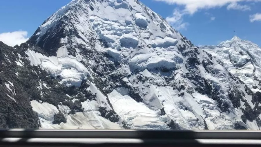 View of snow-covered Mount Cook from helicopter window