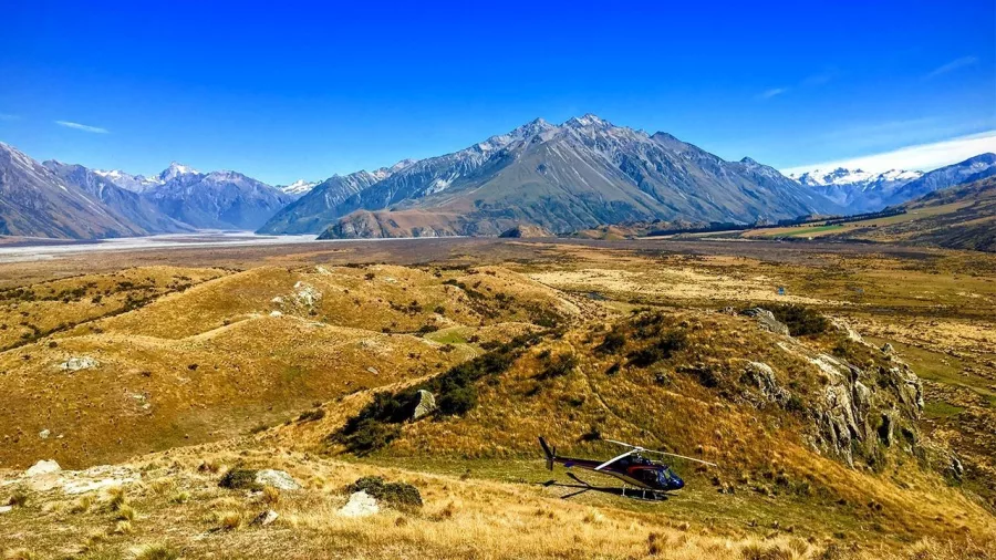 Scenic aerial view of Edoras filming location from Lord of the Rings with helicopter landing nearby
