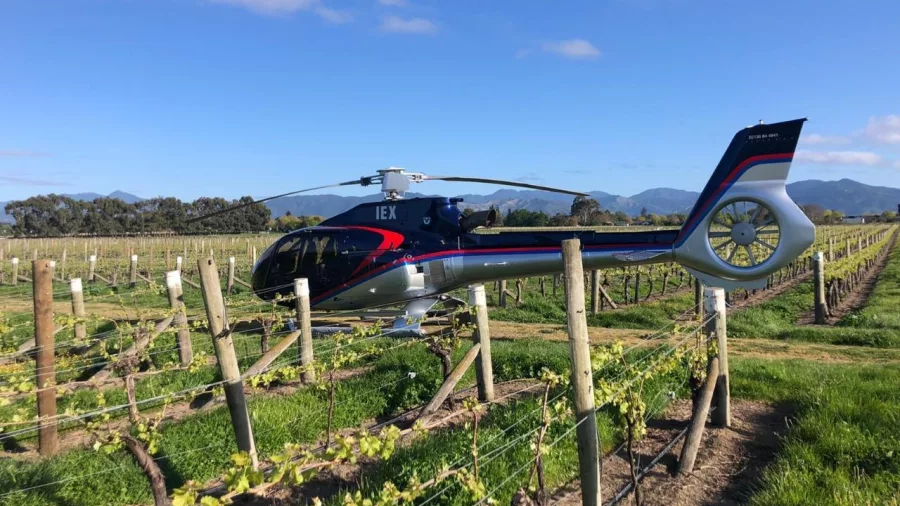 Helicopter nestled among the vines at Black Estate Winery in North Canterbury