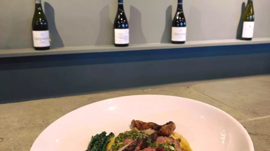 Lamb dish with seasonal ingredients served with local wine at Black Estate’s tasting room