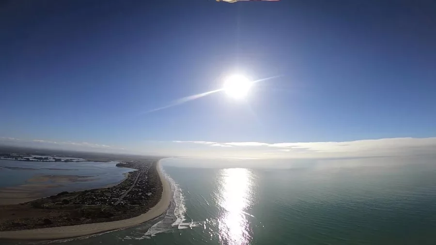 Aerial helicopter view of Pegasus Bay coastline near Christchurch