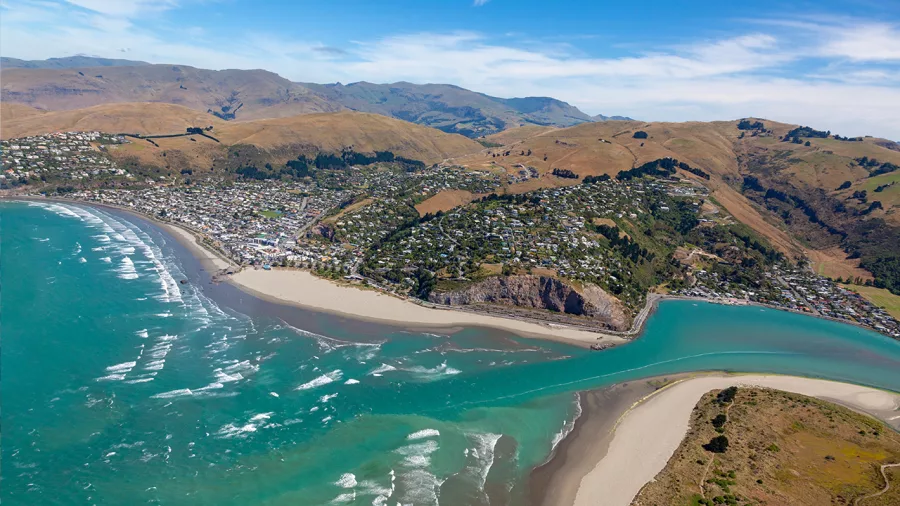 Helicopter view over Sumner Beach and Christchurch coastline
