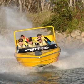Alpine Jet boat approaching with passengers on board
