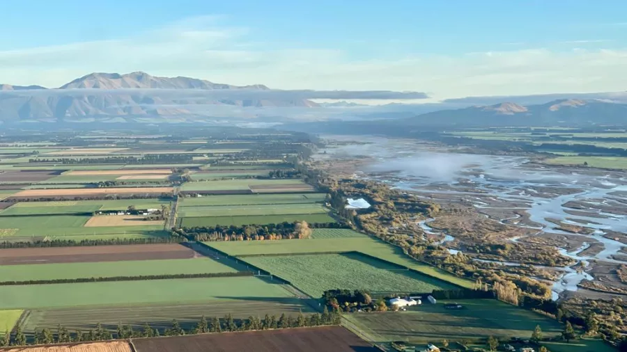 Aerial view of the Canterbury Plains with farmland stretching to the horizon