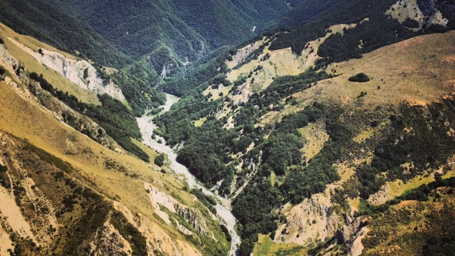Aerial view of Castle Hill Basin and rugged alpine gorge on Southern Alps Explorer flight