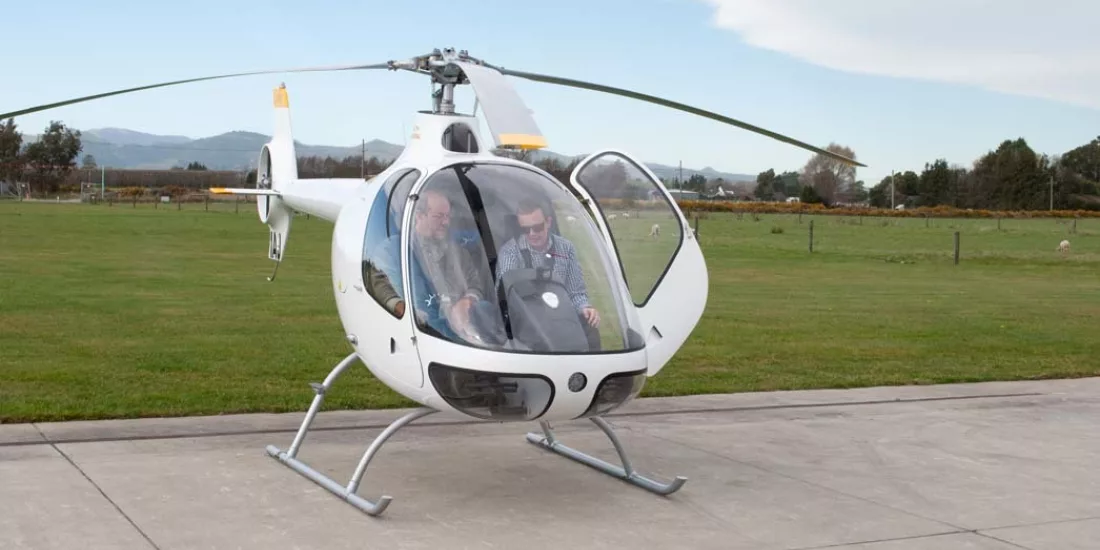 Student and instructor preparing for a YouFly trial flight in a Cabri helicopter in Christchurch