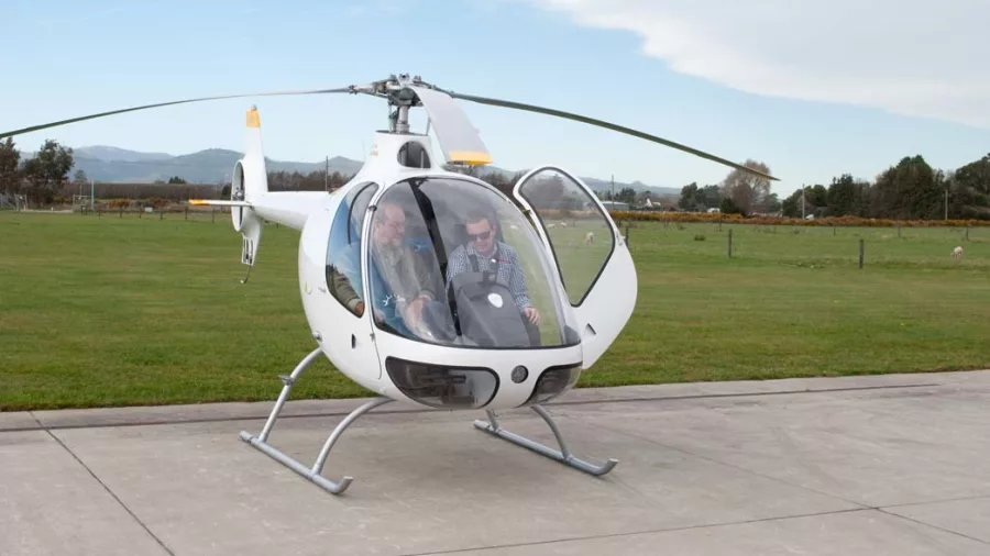 Student and instructor preparing for a YouFly trial flight in a Cabri helicopter in Christchurch