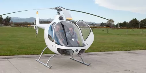 Student and instructor preparing for a YouFly trial flight in a Cabri helicopter in Christchurch
