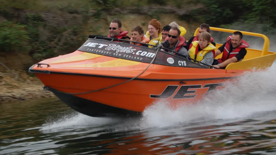 Group enjoying a high-speed jet boat ride on the Waimakariri River near Christchurch