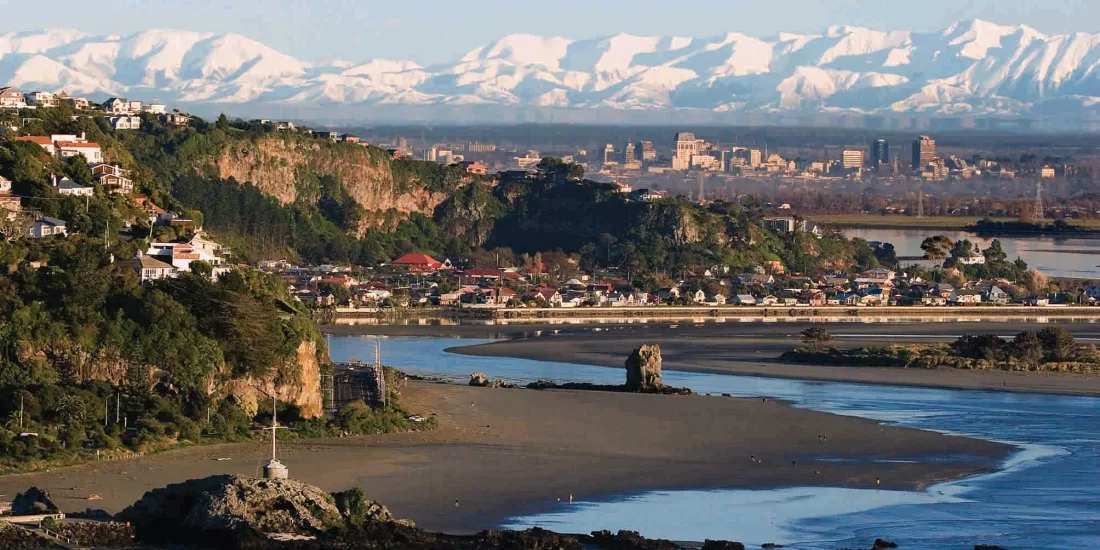 Panoramic view from Sumner Beach over Christchurch city with the Southern Alps in the background.