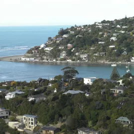View of the Sumner coastline and residential headland in Christchurch, New Zealand.