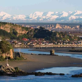 Panoramic view from Sumner Beach over Christchurch city with the Southern Alps in the background.