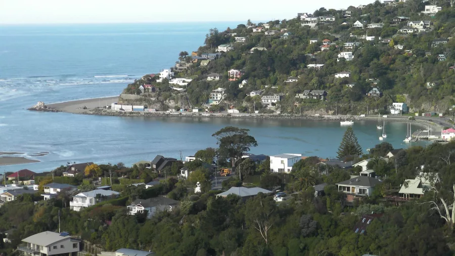 View of the Sumner coastline and residential headland in Christchurch, New Zealand.