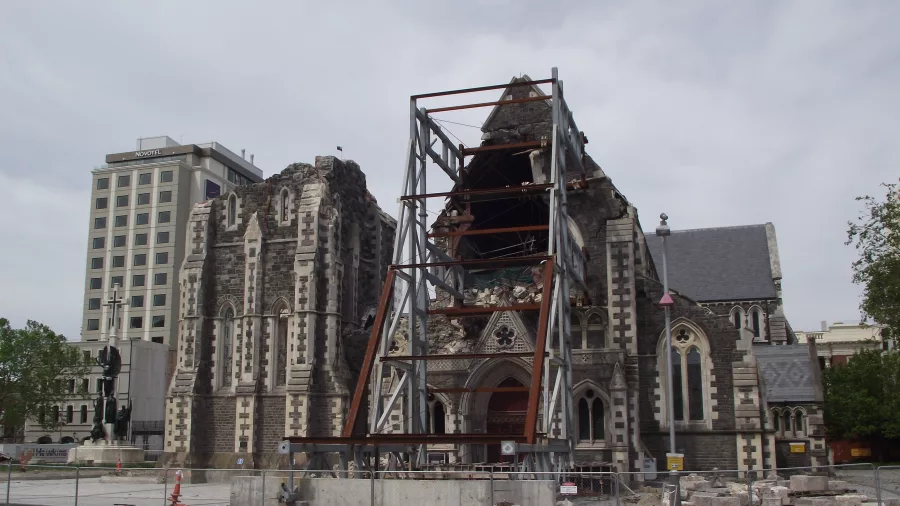 Earthquake-damaged Christchurch Cathedral, partially collapsed and reinforced with steel framing.