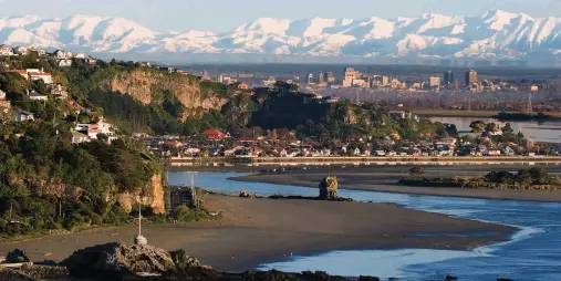 Panoramic view from Sumner Beach over Christchurch city with the Southern Alps in the background.