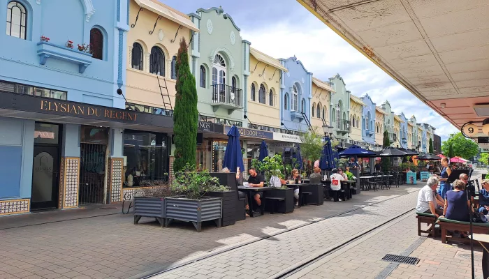 Colourful heritage buildings with outdoor seating on Regent Street, Christchurch