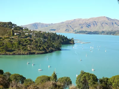 Sailboats anchored at Corsair Bay in Lyttelton Harbour, Banks Peninsula