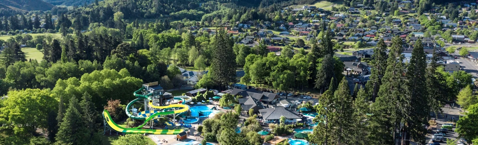 Aerial view of Hanmer Springs Thermal Pools and Spa with surrounding mountains