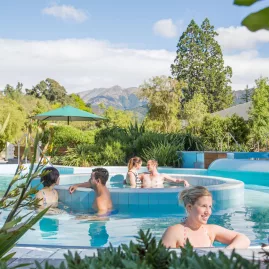 People relaxing in the outdoor thermal aqua pools at Hanmer Springs