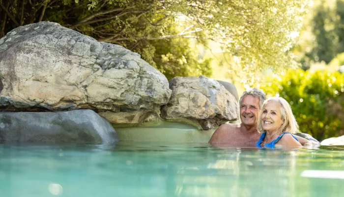 Couple relaxing in rock pools at Hanmer Springs Thermal Pools and Spa