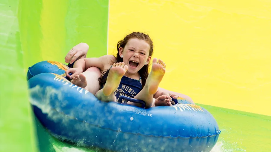 Child riding the Conical Thrill water slide at Hanmer Springs Thermal Pools and Spa