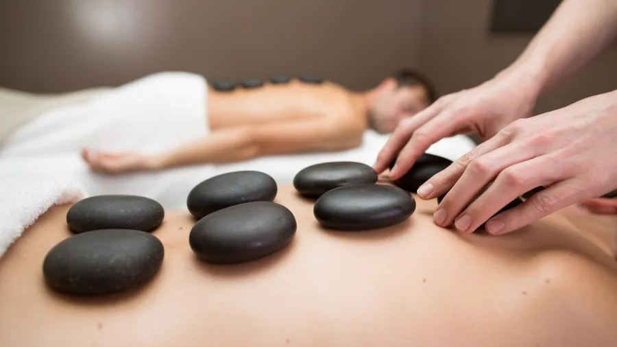 Couple enjoying hot stone massage at Hanmer Springs Spa