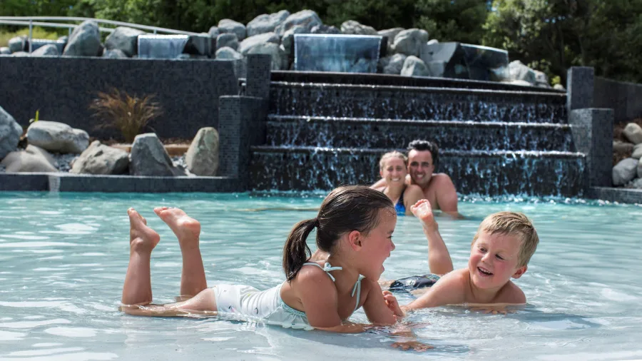 Family enjoying the Cascades Pool at Hanmer Springs Thermal Pools & Spa
