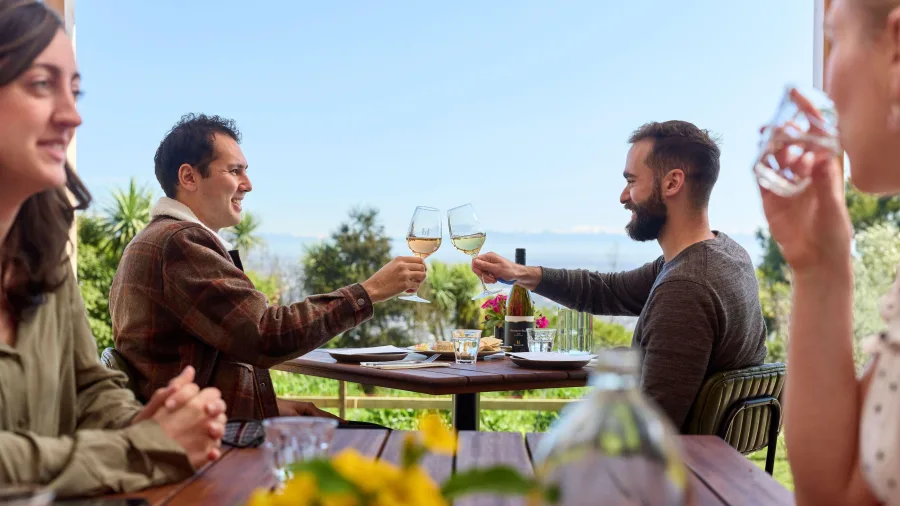 Friends enjoying wine and dining at Tussock Hill Vineyard in Waipara