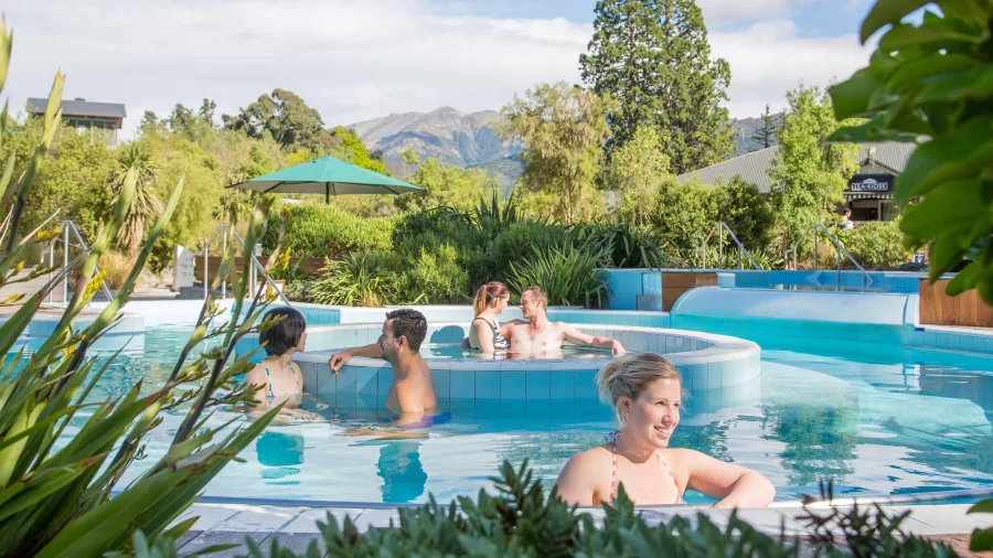 People relaxing in the outdoor thermal aqua pools at Hanmer Springs