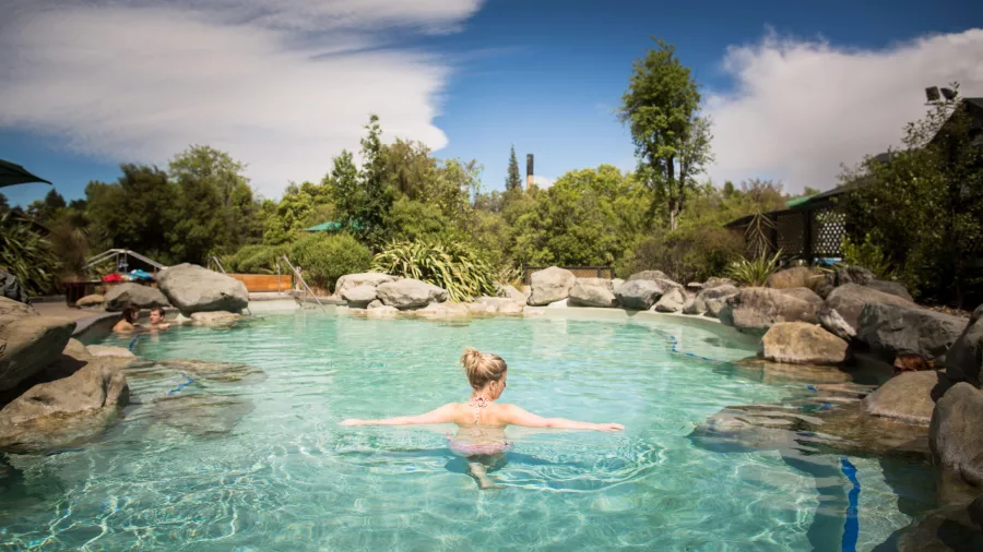 Woman relaxing in a rock pool at Hanmer Springs Thermal Pools
