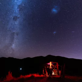 Visitors gather beneath the stars at a zipline station in Kaikōura’s Dark Sky Sanctuary.