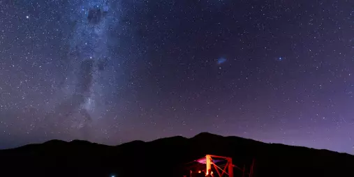 Couple stargazing together beneath the Milky Way in Kaikōura.