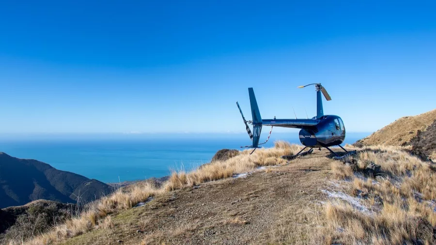 Helicopter landed on Mt Fyffe with panoramic views over the Kaikōura coastline and surrounding mountain ranges