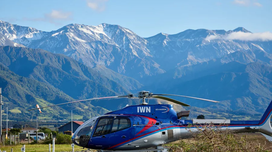 Kaikōura Helicopters aircraft parked with Seaward Kaikōura Ranges in background