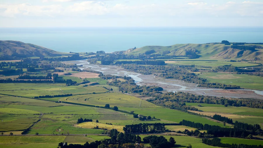 Aerial view across Canterbury Plains with rivers flowing to the Pacific Ocean