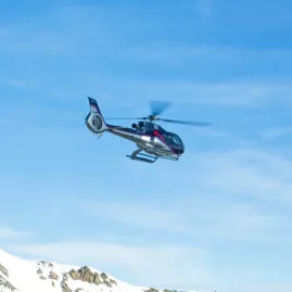 Kaikōura Helicopters flying above snow-covered mountain range on Top n Tail tour