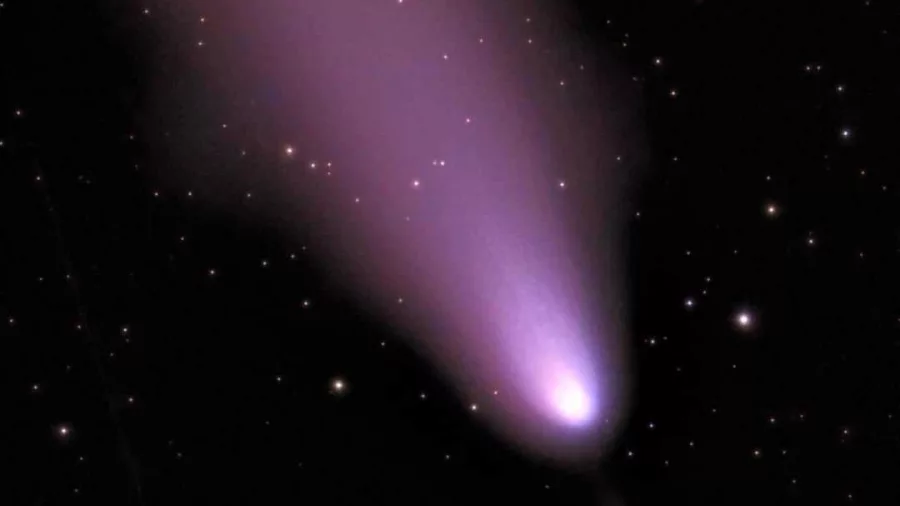 Glowing purple comet captured through telescope on a Hanmer Springs stargazing night