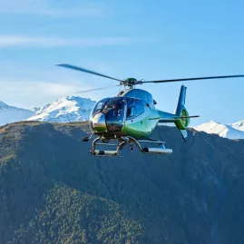 Helicopter approaching secluded picnic landing site on Mt Fyffe, Kaikōura