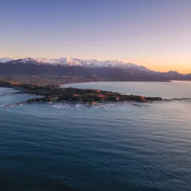 Aerial view of Kaikōura Peninsula and coastline at sunset from scenic helicopter flight
