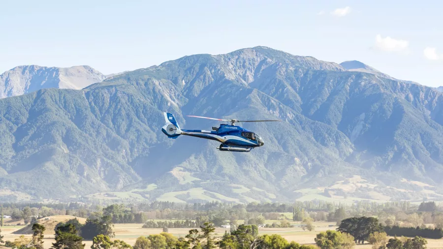 Helicopter flying with Kaikōura’s Seaward Ranges as a stunning backdrop